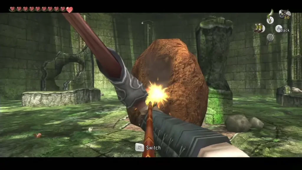 Link throwing a bomb that bursts against the boulder in the guardian room Link throwing a bomb that bursts against the boulder in the guardian room