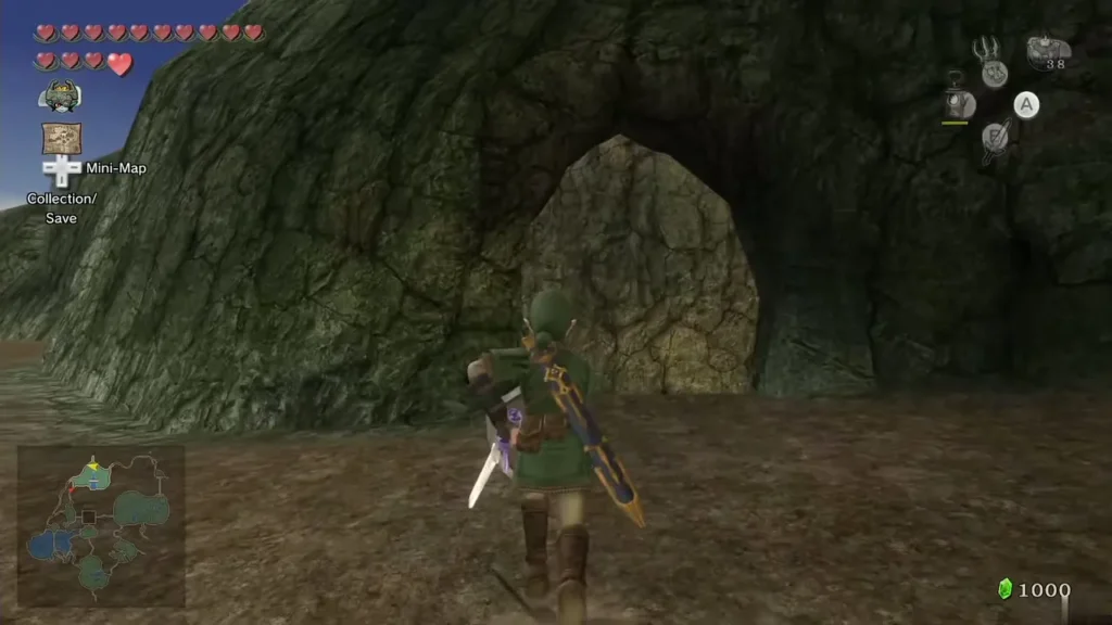 Link stands at the mouth of a rocky cave arch in the north Link stands at the mouth of a rocky cave arch in the north