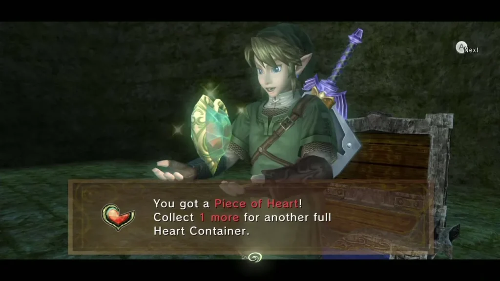 Link holding up the Piece of Heart from the chest at the end of the rail track Link holding up the Piece of Heart from the chest at the end of the rail track