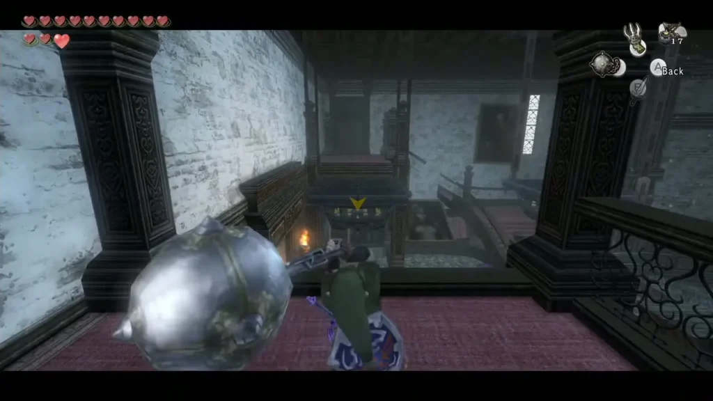 Link swinging the Ball and Chain toward a chandelier in the Snowpeak hall Link swinging the Ball and Chain toward a chandelier in the Snowpeak hall