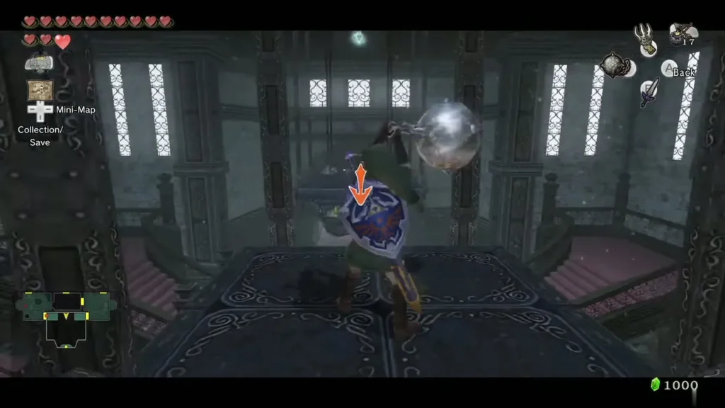 Link holding the Ball and Chain up toward its target in the Snowpeak entrance room Link holding the Ball and Chain up toward its target in the Snowpeak entrance room