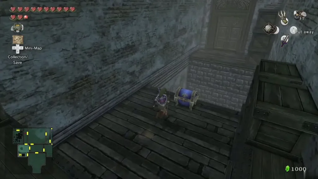 Link in the hidden room under the broken floor, beside a blue chest Link in the hidden room under the broken floor, beside a blue chest