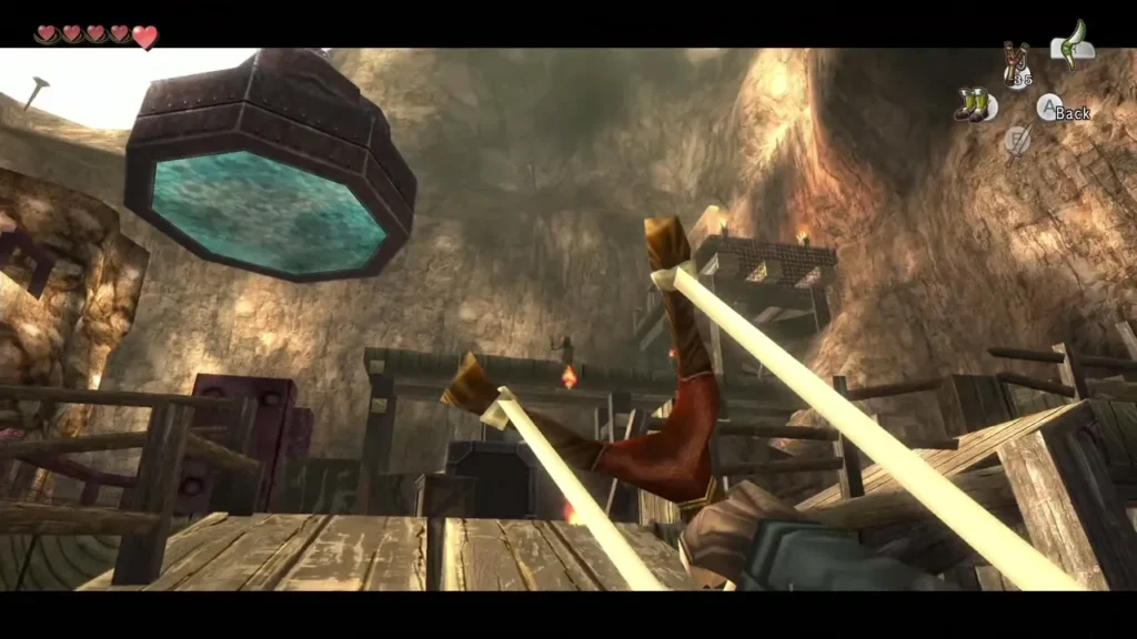 Link aiming the Slingshot across the plank walkways of a mine courtyard Link aiming the Slingshot across the plank walkways of a mine courtyard