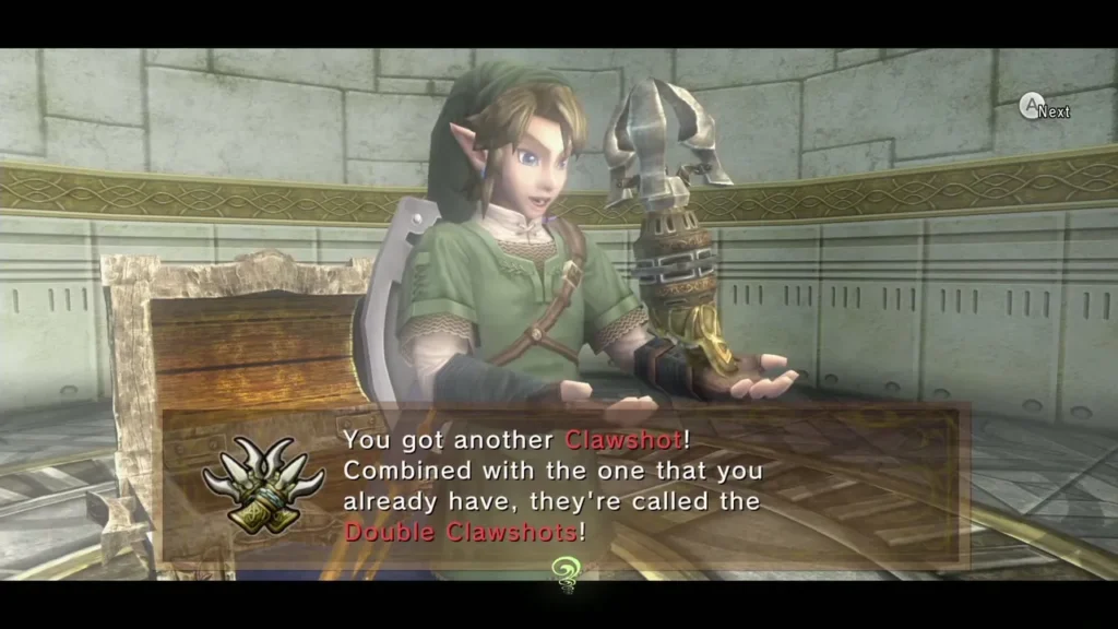 Link holding up the second Clawshot with the Double Clawshots message box Link holding up the second Clawshot with the Double Clawshots message box