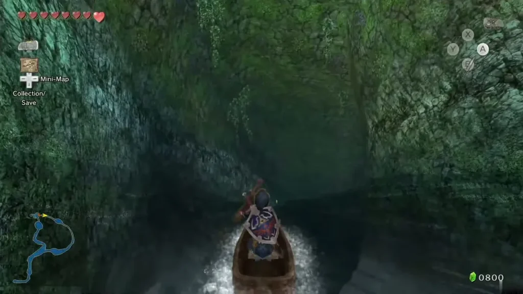Link paddling a canoe through a cave on the river toward Lake Hylia Link paddling a canoe through a cave on the river toward Lake Hylia