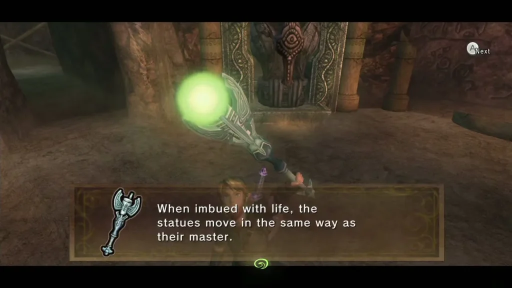 Link holding the glowing Dominion Rod after its power returns, with the statue behind him