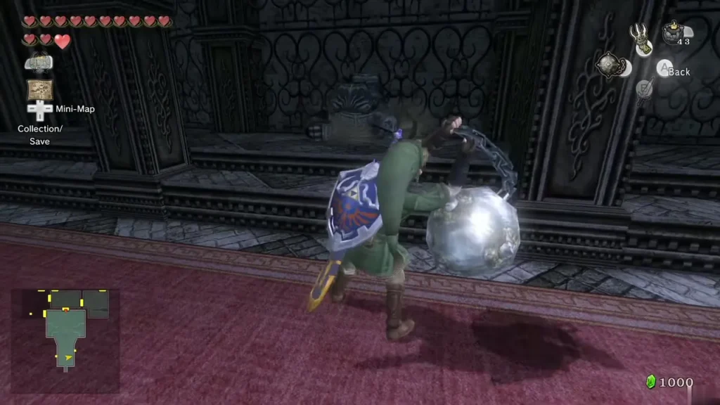 Link swinging the Ball and Chain across the red-carpeted Snowpeak Ruins entrance hall Link swinging the Ball and Chain across the red-carpeted Snowpeak Ruins entrance hall