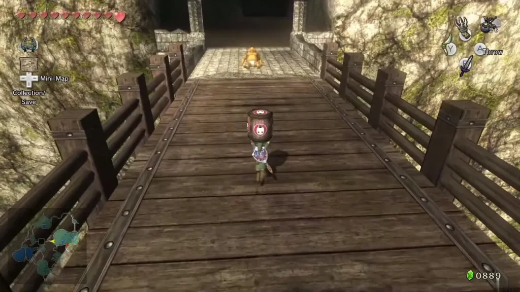 Link carrying the barrel across the bridge toward the Goron waiting at the far end Link carrying the barrel across the bridge toward the Goron waiting at the far end