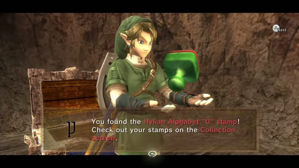 Link holding up the Hylian Alphabet U stamp with its message box Link holding up the Hylian Alphabet U stamp with its message box